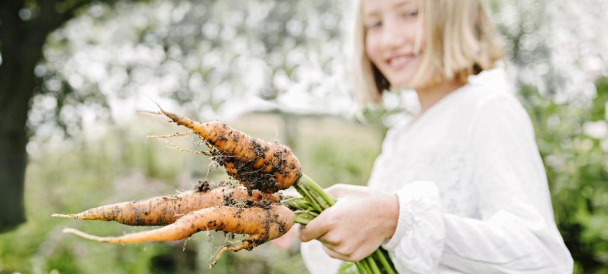 girl-with-carrots-from-the earth